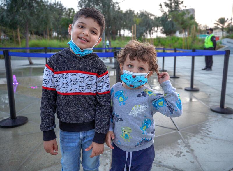 Abu Dhabi, United Arab Emirates, January 21, 2021.  Ahmed Rawashdeh 4, and brother Kareem, 2, at the fountain area in Al Fay Park on Reem Island. 
Victor Besa/The National 
Section:  LF
Reporter: Panna Munyal