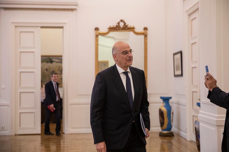 Greek foreign Minister Nikos Dendias arrive for a meeting to brief political party representatives on developments for the maritime boundary deal between Turkey and Libya in Athens, on Tuesday, Dec. 10, 2019. Greece has sent two letters to the United Nations explaining its objections to the deal and asking for the matter to be taken up by the U.N. Security Council, the government spokesman said Tuesday. (AP Photo/Petros Giannakouris)