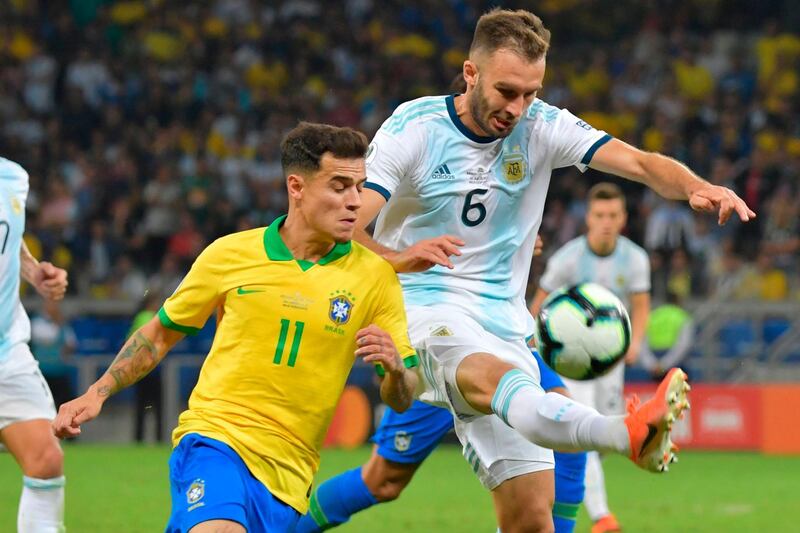 Brazil's Philippe Coutinho and Argentina's German Pezzella vie for the ball. AFP