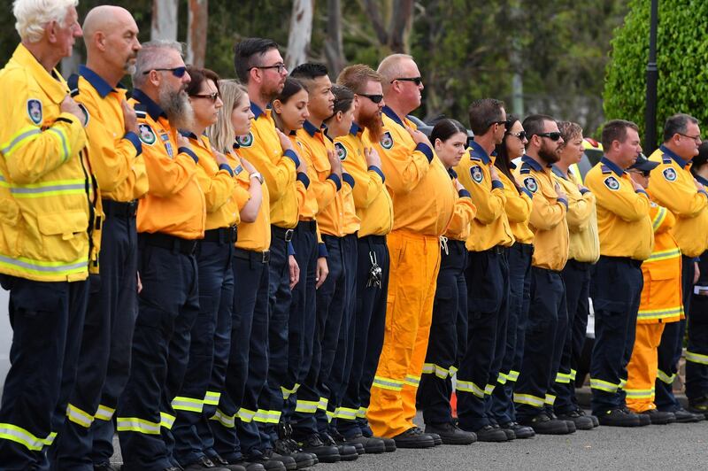 Rural Fire Service volunteers form an honor guard during the funeral for NSW RFS volunteer Andrew O'Dwyer at Our Lady of Victories Catholic Church in Horsley Park, Sydney.  EPA