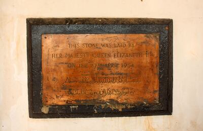 A battered bronze plaque in Arabic and English marking the year 1954 - when Queen Elizabeth laid the founding stone - is fixed on a wall at Al Joumhouria hospital in Aden. AFP