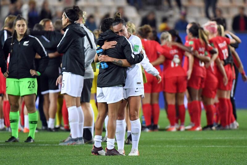 New Zealand's players react at the end of the France 2019 Women's World Cup Group E football match between Canada and New Zealand, on June 15, 2019, at the Alpes Stadium in Grenoble, central-eastern France.  / AFP / Jean-Pierre Clatot
