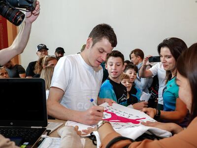 Abu Dhabi, UAE, February 28, 2018.   
Pre-race conference , ITU World Triathlon AbuDhabi.  (center)  Jonathan Brownlee signs some autographs for his fans after the press conference.
Victor Besa / The National
Sports
Reporter:  Amith Passela