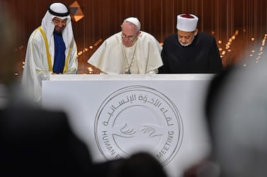 Sheikh Mohamed bin Zayed, Crown Prince of Abu Dhabi and Deputy Supreme Commander of the Armed Forces, Pope Francis and Sheikh Ahmed Al Tayeb, Grand Imam of Al Azhar, sign the Document of Human Fraternity in February 2019. AFP