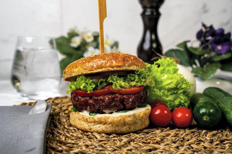 You can munch on a vegan Beyond Meat burger at the Reel Dine-In cinema. Courtesy Reel Cinemas