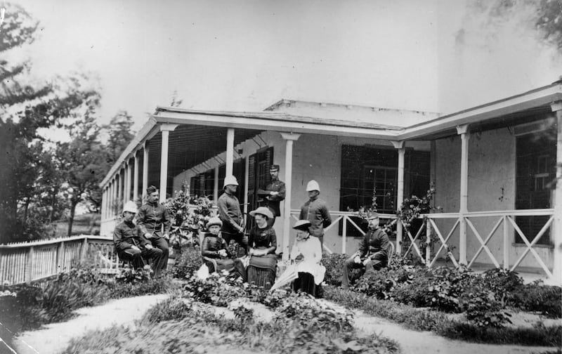 circa 1880:  A group of British expatriots, some in military uniform, sitting outside their house in India.  (Photo by Hulton Archive/Getty Images)