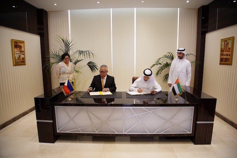 From right, Mohamed Al Hussaini, UAE Minister of State for Financial Affairs, and Ramon Lopez, secretary of the Philippines Department of Trade and Industry. Photo: UAE Ministry of Finance