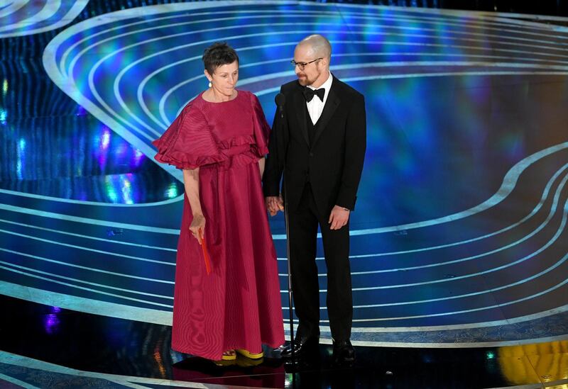 HOLLYWOOD, CALIFORNIA - FEBRUARY 24: (L-R) Frances McDormand and Sam Rockwell speak onstage during the 91st Annual Academy Awards at Dolby Theatre on February 24, 2019 in Hollywood, California. (Photo by Kevin Winter/Getty Images)