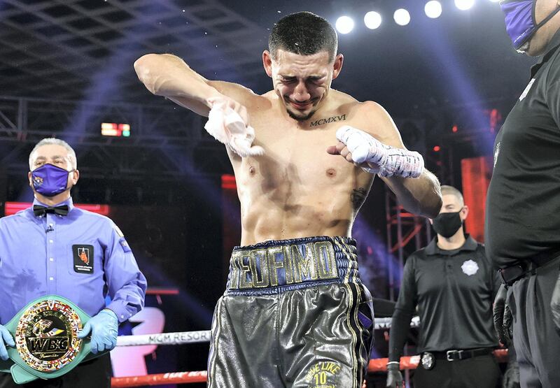 LAS VEGAS, NEVADA - OCTOBER 17: In this handout image provided by Top Rank, Teofimo Lopez Jr celebrates after defeating Vasiliy Lomachenko (not pictured) in their Lightweight World Title bout at MGM Grand Las Vegas Conference Center on October 17, 2020 in Las Vegas, Nevada. (Photo by Mikey Williams/Top Rank via Getty Images)