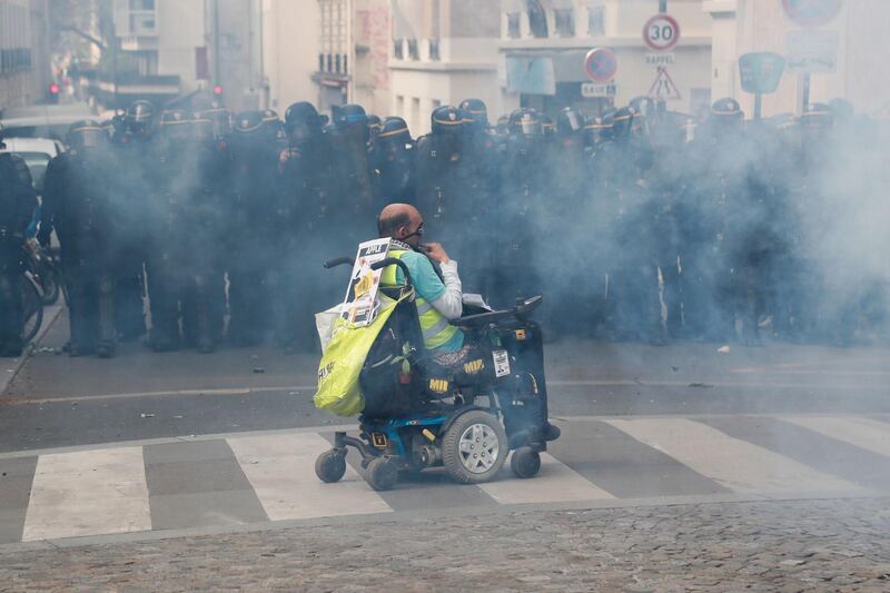 Paris riot police fired teargas as they squared off against hardline demonstrators among tens of thousands of May Day protesters who flooded the city on May 1. AFP