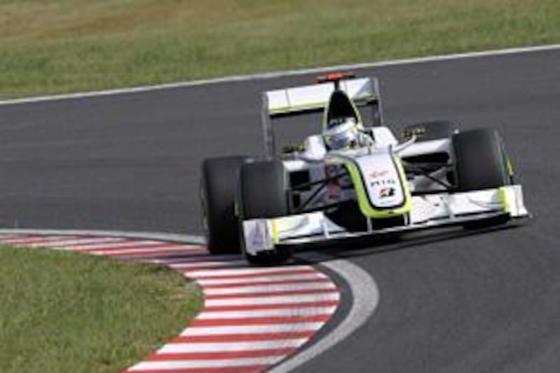 Brawn GP driver Jenson Button, the championship leader, was handed a five-place grid penalty for tomorrow's Japanese Grand Prix for not slowing down while yellow flags for caution were shown during the qualifying session.