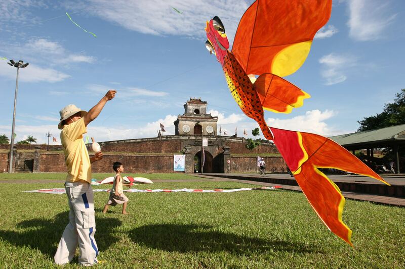 TO GO WITH: LIFESTYLE-VIETNAM-ARTS-FESTIVAL-HUE BY FRANK ZELLER
A man flies a kite in the Citadel grounds of Hue on June 3, 2008 in the central city of Hue. The Hue Festival will include a traditional kite flying contest. Communist Vietnam on June 4, 2008 opened an internatioal arts festival with a parade celebrating the country's forgotten royal heritage with pomp, elephants and hundreds of actors in costume.  AFP PHOTO/Frank ZELLER