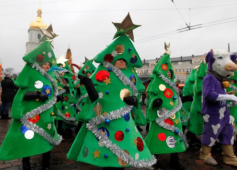 Participants attend a Christmas and New Year's Parade in Kiev, Ukraine.  EPA