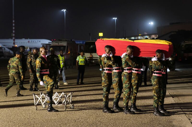 The coffin containing the remains of former Ghana international football player Christian Atsu arrive at Kotoka International Airport in Accra, Ghana, on February 19, 2023. Reuters