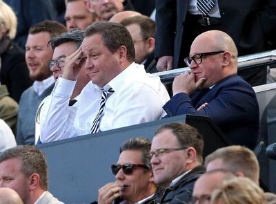 Mike Ashley, centre, has been a polarising figure at Newcastle United. Scott Heppell / AFP