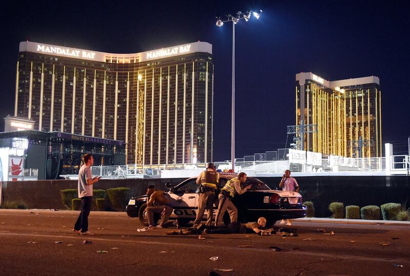 David Becker won 1st prize of the 'Spot News - Stories' category for a picture that shows Las Vegas Police outside the concert grounds after a gunman opened fire on concertgoers at the Route 91 country music festival in Las Vegas. EPA/DAVID BECKER/GETTY IMAGES