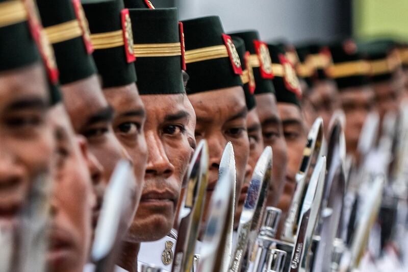 Members of the Malaysian Armed Forces take part in a Trooping of Colours ceremony, in conjunction with Malaysian King Sultan Muhammad V's official birthday, in Putrajaya, Malaysia. Ahmad Yusni/EPA