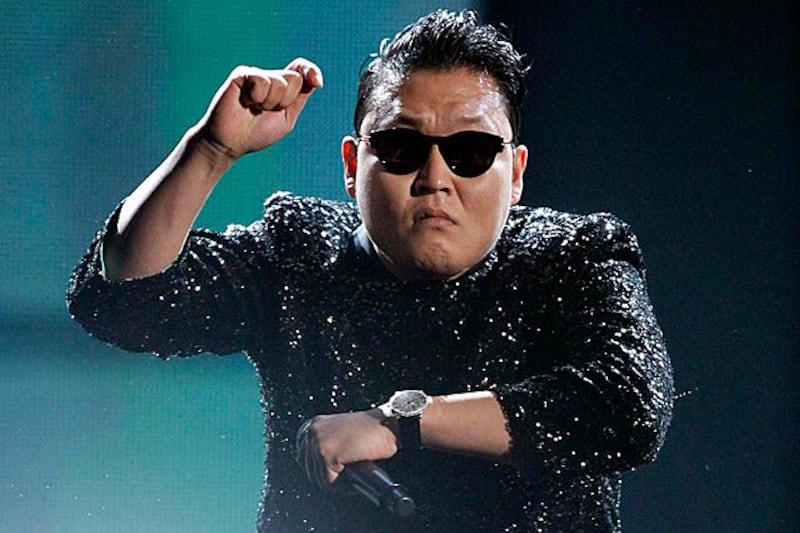 South Korean rapper Psy performs "Gangnam Style" at the 40th American Music Awards in Los Angeles, California, in this November 18, 2012 file photo.   Psy's music video "Gangnam Style" became the most watched item on YouTube on November 24, 2012,  with over 800 million views. REUTERS/Danny Moloshok/Files (UNITED STATES - Tags: ENTERTAINMENT SOCIETY)