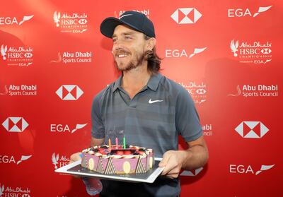 ABU DHABI, UNITED ARAB EMIRATES - JANUARY 19:  Tommy Fleetwood of England holds a cake presented to him by Rory McIlroy of Northern Ireland for his birthday after round two of the Abu Dhabi HSBC Golf Championship at Abu Dhabi Golf Club on January 19, 2018 in Abu Dhabi, United Arab Emirates.  (Photo by Matthew Lewis/Getty Images)