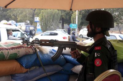 Pakistani troops stand guard outside the Marriott Hotel in Islamabad in 2022. EPA