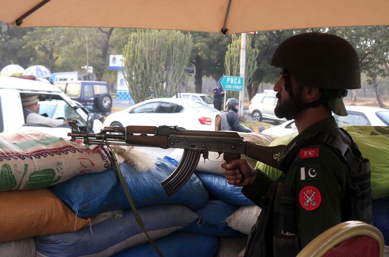 Pakistani security officials stand guard outside the Marriott hotel in Islamabad after a security alert. EPA