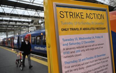 A commuter at Waterloo Station in London. Members of the RMT rail workers' union are beginning a new wave of strike action, causing major disruption to the UK's rail network. EPA