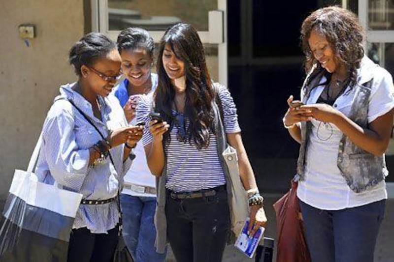 Mobile generation: South African students get reacquainted with their phones after class at Witwatersrand University in Johannesburg. Stephane De Sakutin / AFP Photo