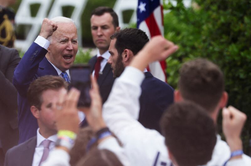 U. S.  President Joe Biden cheers with team members during the welcome of Team USA at the White House to celebrate their participation and success at the Tokyo 2020 Summer Olympic and Paralympic Games and Beijing 2022 Winter Olympic and Paralympic Games, in Washington, U. S.  May 4, 2022.  REUTERS / Evelyn Hockstein