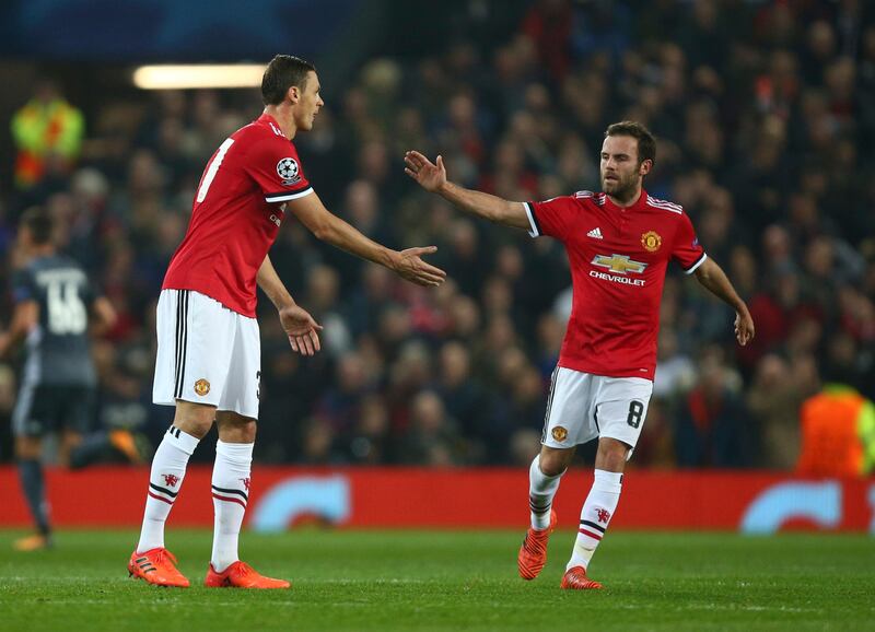 Manchester United's Nemanja Matic, left, celebrates his team's first goal with Juan Mata, during the Champions League group A soccer match between Manchester United and Benfica, at Old Trafford, in Manchester, England, Tuesday, Oct. 31, 2017. (AP Photo/Dave Thompson)