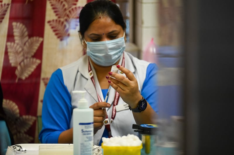 India administered its billionth Covid-19 vaccine dose on October 21, according to the health ministry, half a year after a devastating surge in cases brought the health system close to collapse. Prakash Singh / AFP