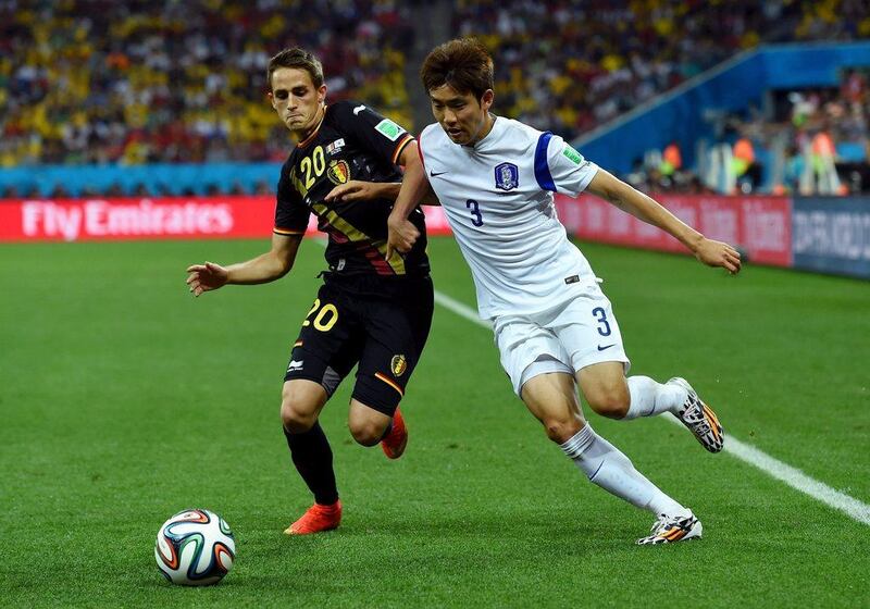 Adnan Januzaj of Belgium and Yun Suk-Young of South Korea compete for the ball during their match on Thursday at the 2014 World Cup in Sao Paulo, Brazil. Stu Forster / Getty Images