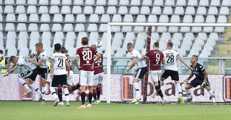 Torino's Nicolas Nkoulou scores the opening goal against Parma. EPA