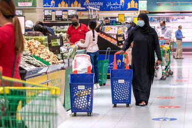 Shoppers at the Lulu Hypermarket in Al Wahda Mall, Abu Dhabi, one location which will soon offer free weekly PCR tests. Victor Besa / The National. 