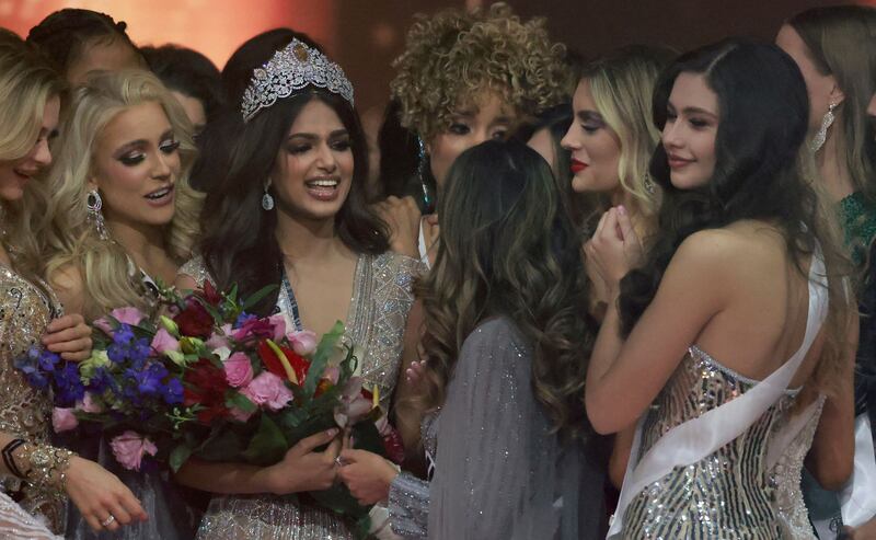 Miss Universe contestants congratulate Miss India, Harnaaz Sandhu, as she is crowned Miss Universe. AFP