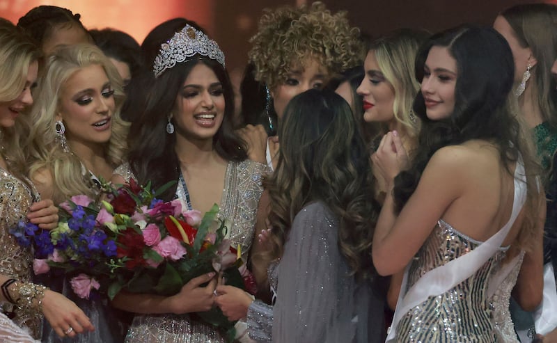 Miss Universe contestants congratulate Miss India, Harnaaz Sandhu, as she is crowned Miss Universe. AFP