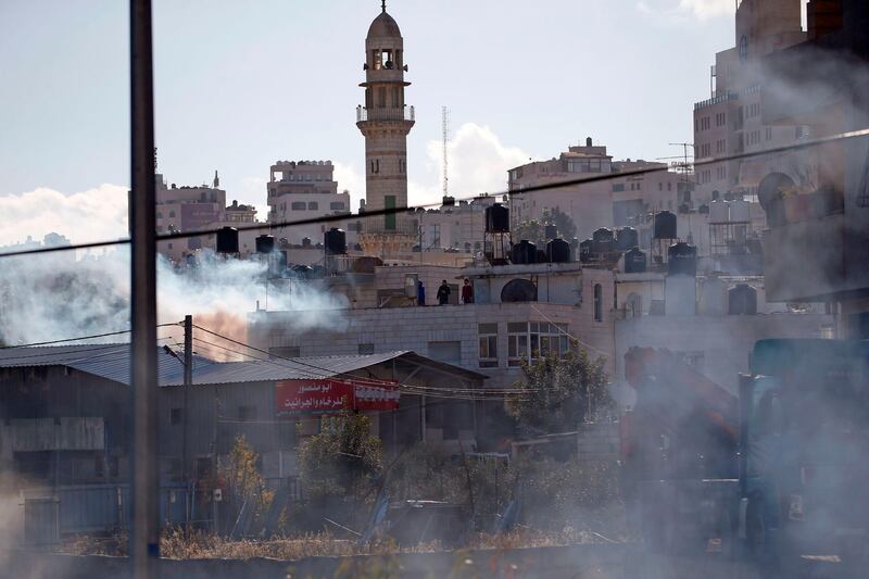 Smoke from burning tires and tear gas billows during clashes between Palestinian demonstrators and Israeli soldiers in Ramallah. AFP