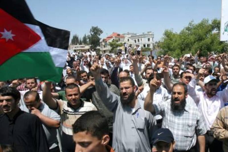 Jordanian Muslim Brotherhood protesters chant slogans demanding that Prime Minister Marouf al-Bakhit step down and reforms to be implemented during a demonstration in Amman, Jordan, Friday, June 24, 2011.(AP Photo/ Nader Daoud)