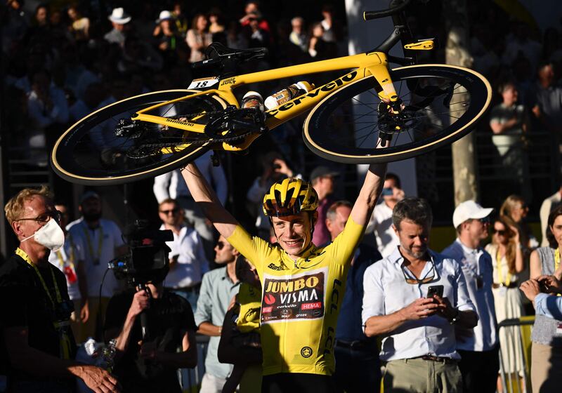 Jumbo-Visma rider Jonas Vingegaard celebrates after winning the 2022 Tour de France. AFP
