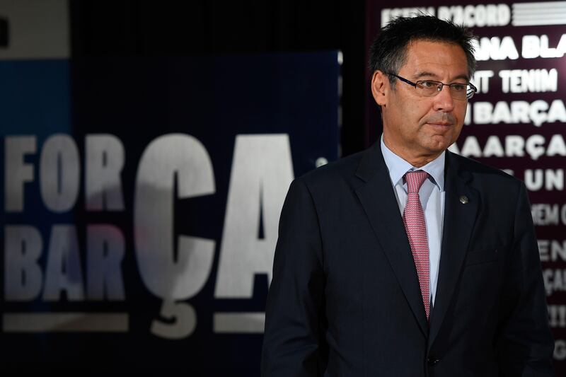 Barcelona's president Josep Maria Bartomeu looks on during the official presentation of Barcelona's new Brazilian football player Paulinho Bezerra, after signing his new contract with the Catalan club at the Camp Nou stadium in Barcelona on August 17, 2017. / AFP PHOTO / LLUIS GENE