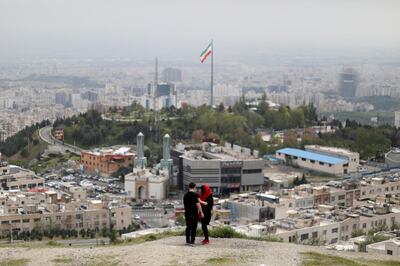 FILE PHOTO: An Iranian couple is seen following the outbreak of the coronavirus disease (COVID-19), in Tehran, Iran, April 30, 2020. WANA (West Asia News Agency)/Ali Khara via REUTERS/File Photo