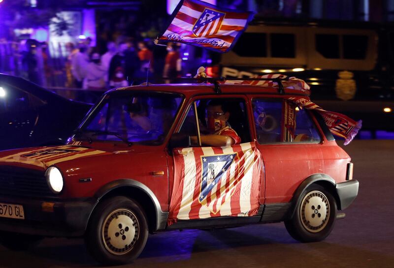 Atletico Madrid fans celebrate the La Liga title at Neptuno Fountain. EPA