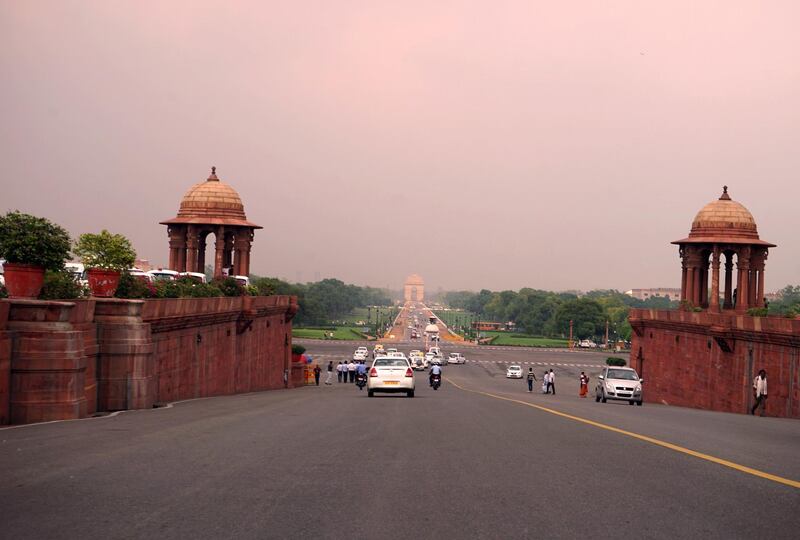 View from Rajpath Marg to India Gate, Delhi, India. Rajpath (meaning 'King's Way') is a ceremonial boulevard in New Delhi, India, that runs from Rashtrapati Bhavan on Raisina Hill through Vijay Chowk and India Gate to the National Stadium. The avenue is lined on both sides by huge lawns, canals and rows of trees. It was designed by Edward Lutyens. (Photo by: Universal History Archive/ Universal Images Group via Getty Images)