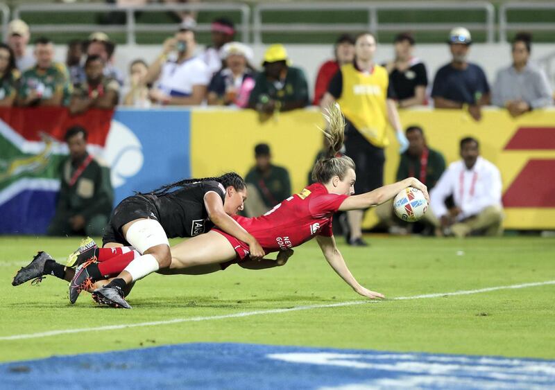 Dubai, United Arab Emirates - December 07, 2019: Julia Greenshields of Canada scores during the match between New Zealand and Canada in the womens final at the HSBC rugby sevens series 2020. Saturday, December 7th, 2019. The Sevens, Dubai. Chris Whiteoak / The National