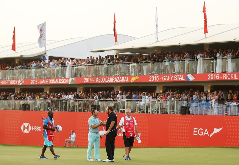 Lowry, right, is congratulated by his playing partner and title rival Sterne.