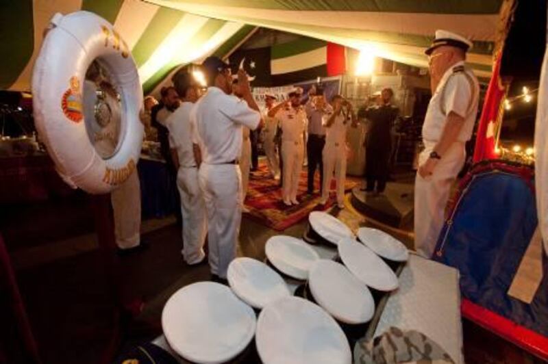 UAE - Dubai - Jan 05 - 2012: A naval officer is received  at the reception organized by Embassy of Pakistan, UAE, on behalf of PNS Khaibar’s Commanding Officers on board the ship at Port Rashid, Dubai ( Jaime Puebla - The National Newspaper )