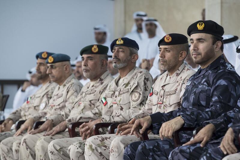 Sheikh Ahmed bin Tahnoon, Chairman of the National Service Authority, second right, and Sheikh Saeed bin Hamdan, third right, attend the military exercise. Ryan Carter / Crown Prince Court - Abu Dhabi