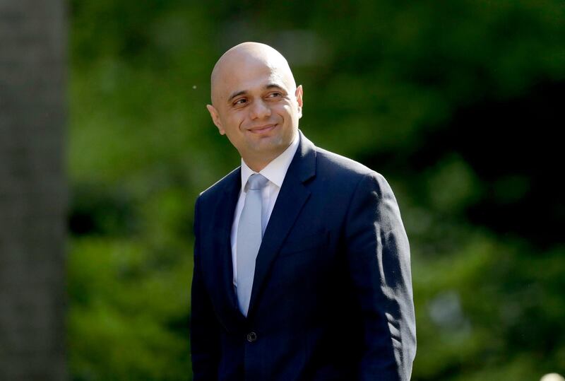 FILE - In this file photo dated Tuesday, May 1, 2018, Britain's newly appointed Home Secretary Sajid Javid arrives for a cabinet meeting at 10 Downing Street in London.  The British government has apologized to 18 long-term U.K. residents from the Caribbean who were deported or detained because they could not produce documents to prove their right to live in the country, with Home Secretary Javid saying their treatment was "completely unacceptable," and has issued a personal apology, Tuesday Aug. 21, 2018. (AP Photo/Matt Dunham, FILE)
