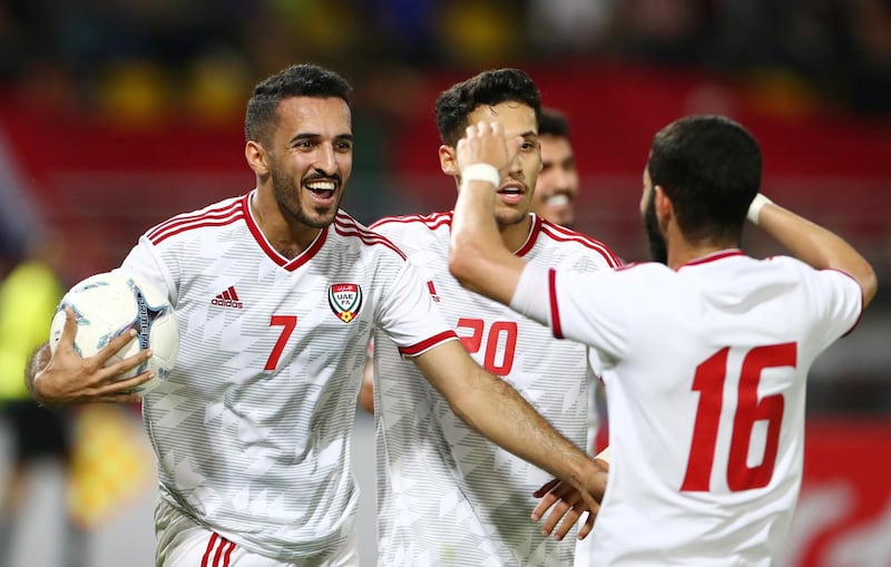 UAE's Ali Mabkhout, left, celebrates after making it 1-1. EPA