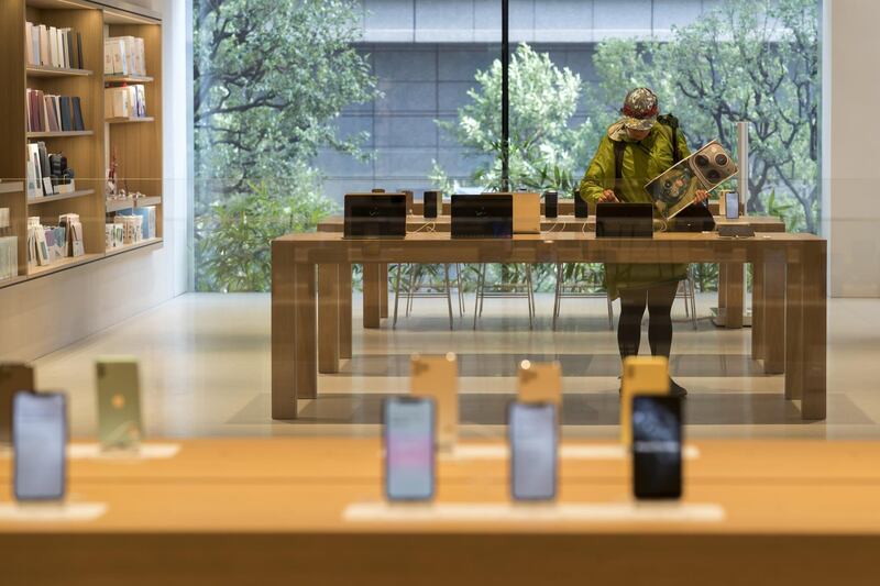 A customer tries an iPhone 11 in Tokyo. Getty Images
