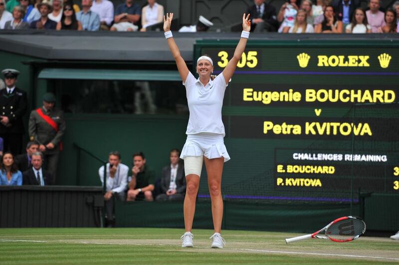 Petra Kvitova celebrates after beating Eugenie Bouchard in the women's singles final on Saturday at the 2014 Wimbledon Championships. Glyn Kirk / AFP